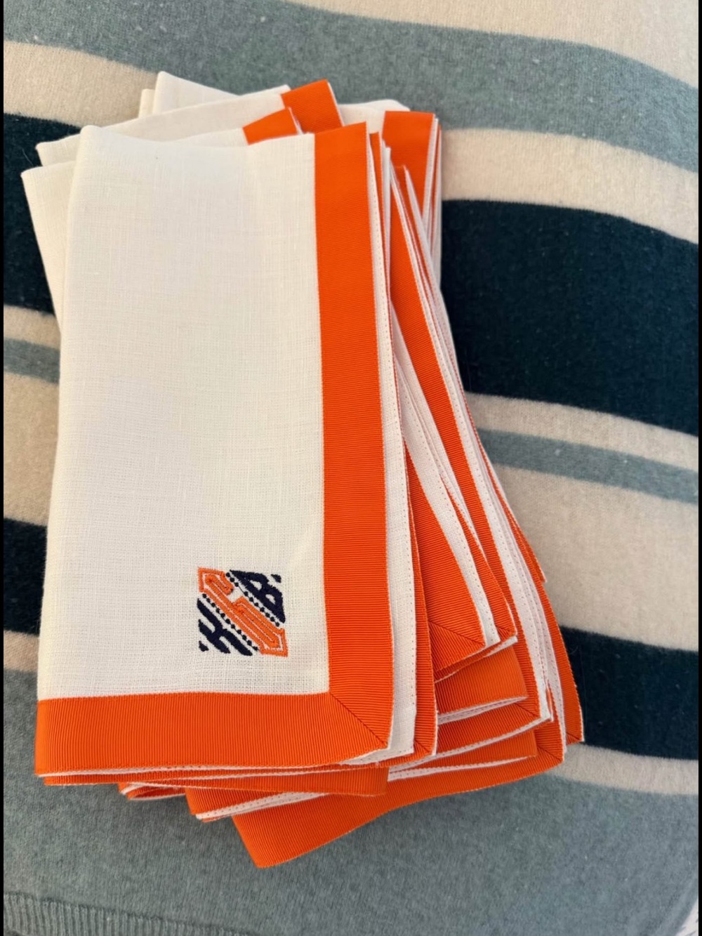 Set of White Linen Napkins with Orange Border and ‘KGB’ Monogram